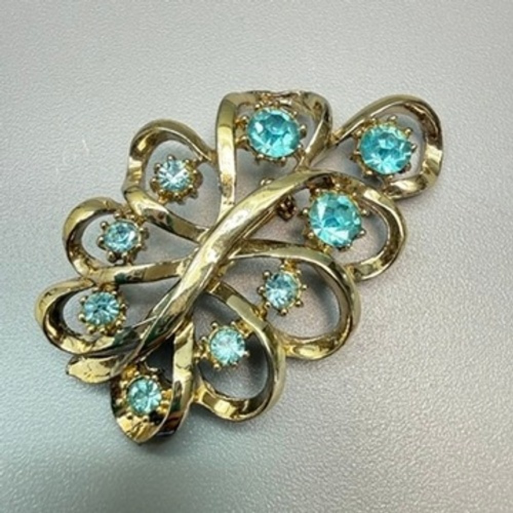 Vintage Coro Gold Tone Blue Rhinestone Brooch Leaf Ribbon Swirl